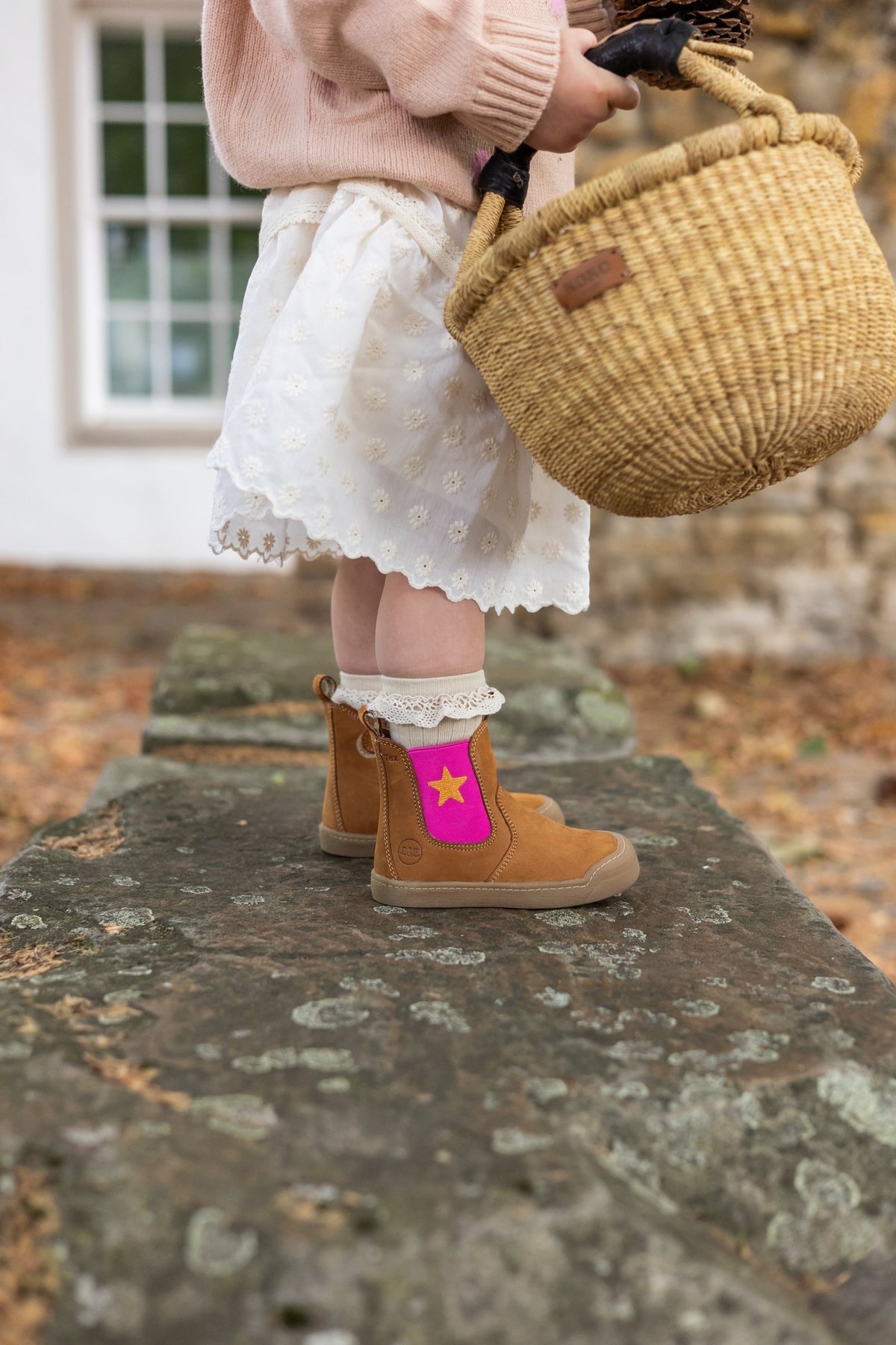 Winter Janne Bootie in camel with a pink star panel, worn with a lace sock