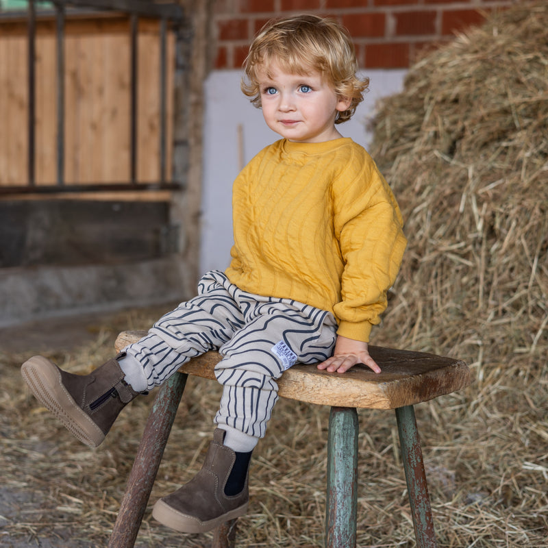 The brown Winter Janne Bootie worn outdoors