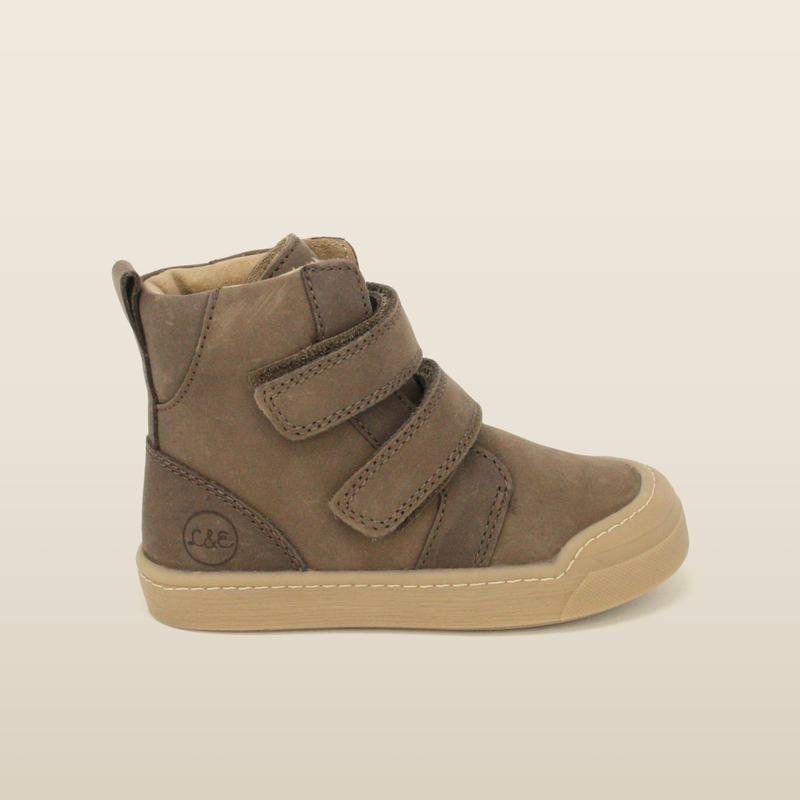 Taupe First Step boot, side profile showing the velcro straps