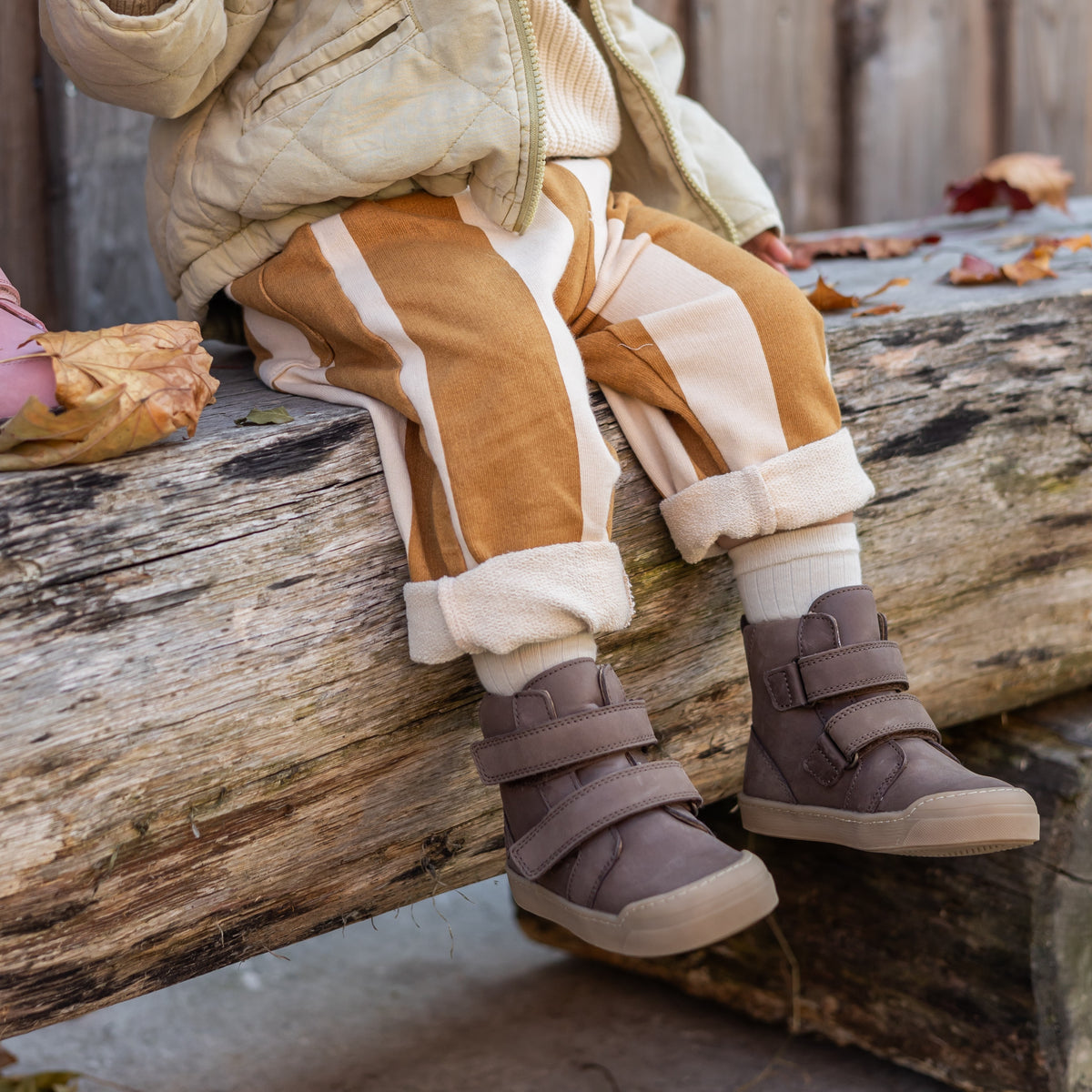 Toddler wearing the First Step Boot in brown