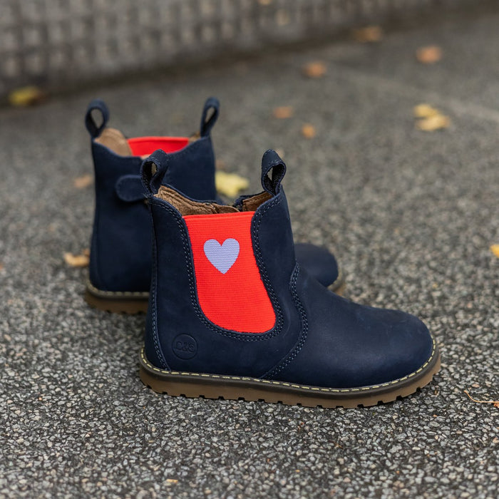 Navy Chelsea boots with a red heart panel on stone