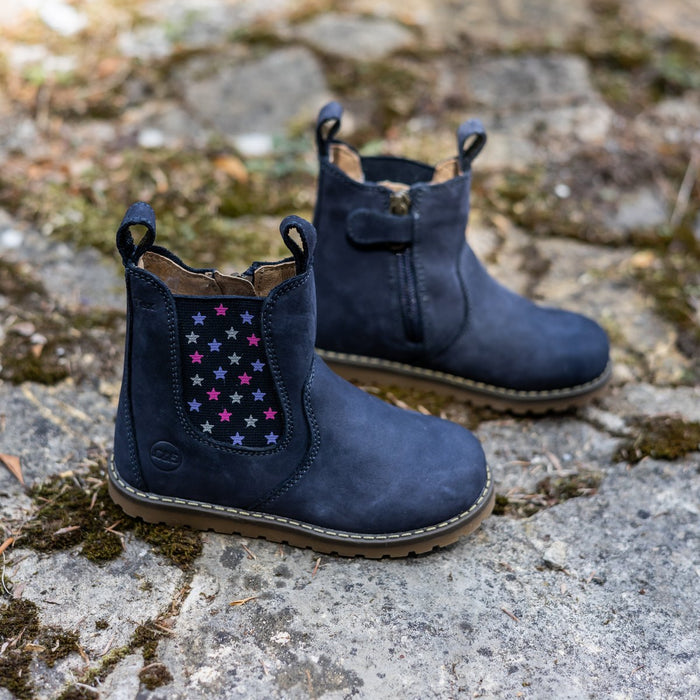 Navy winter Chelsea boots with a star panel on mossy stone